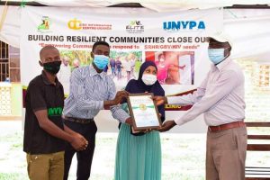 Recieving a certificate of appreciation from MNYPA for being part of building resilient communities project
